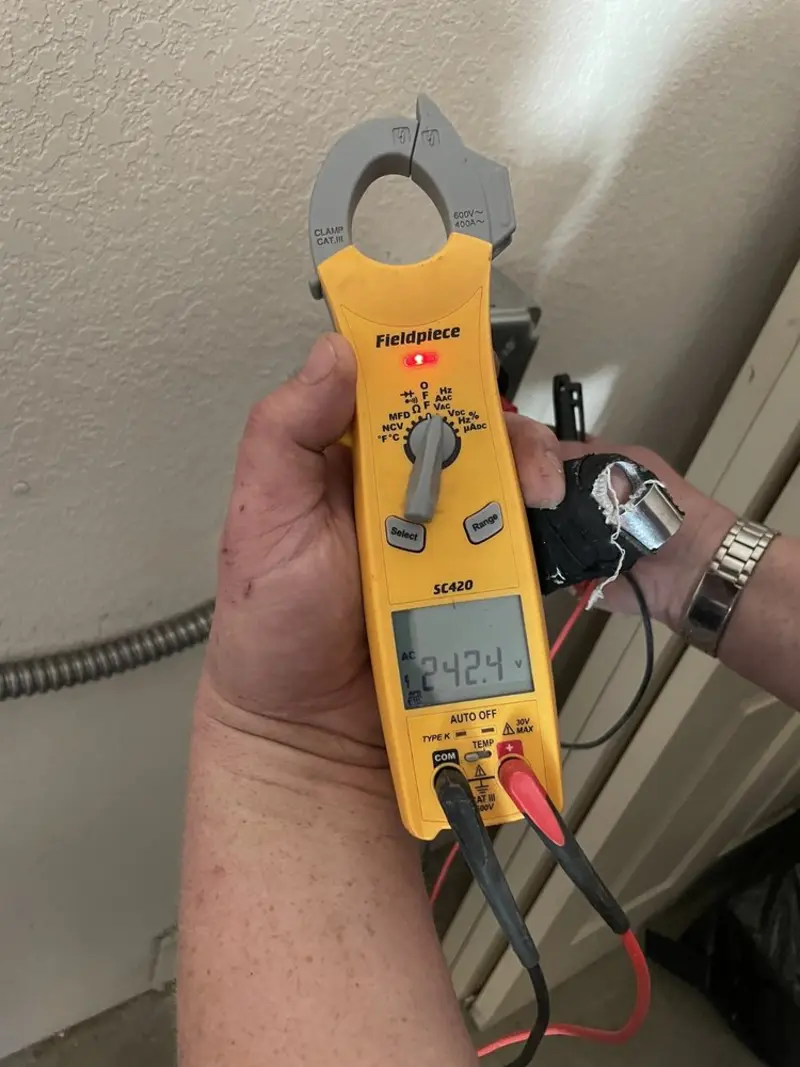 Voltage testing with clamp meter during Recessed Lighting Installation in Wilkinsburg